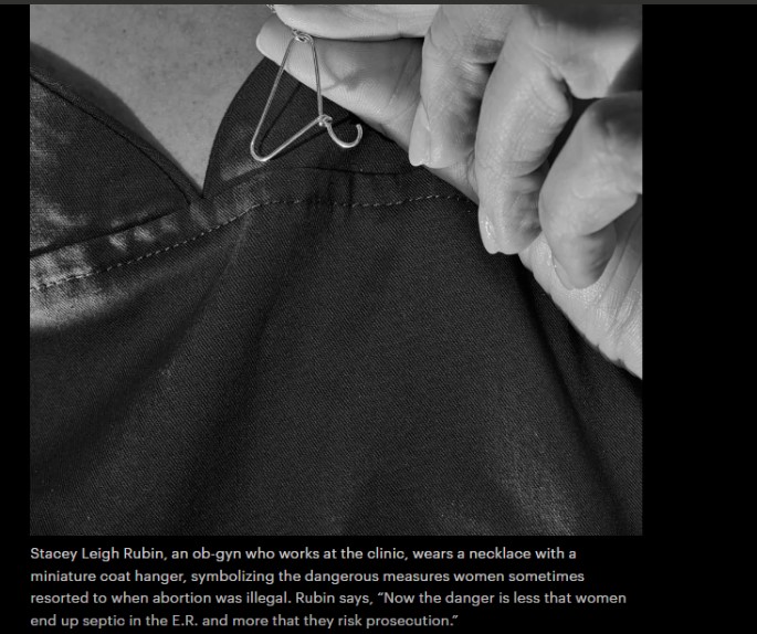 Stacey Rubin holding coat hanger necklace featured in New Yorker article promoting late-term abortion on demand 